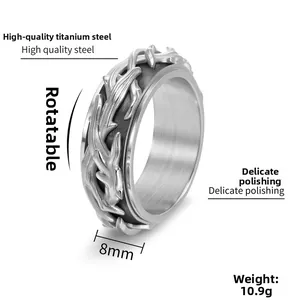 Detailed macro view of 8mm stainless steel spinner ring with rotatable thorn vine pattern