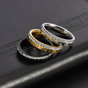 Three-piece Viking rune rings in gold, silver, and black steel with sparkling pavé crystals