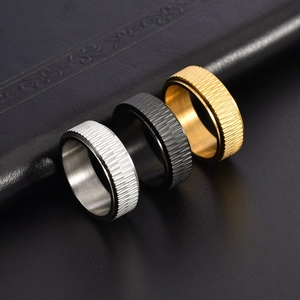 Three-piece set of men's rotatable spinner rings in silver, black, and gold titanium steel