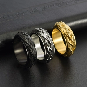Retro stainless steel spinner rings with thorn patterns in black, silver, and gold finishes