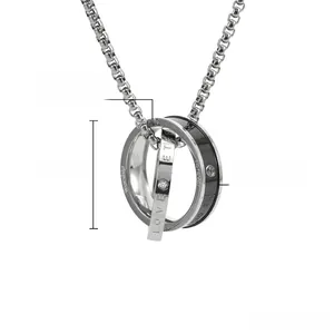 Close-up of titanium steel interlocking rings pendant with LOVE engraving and crystals