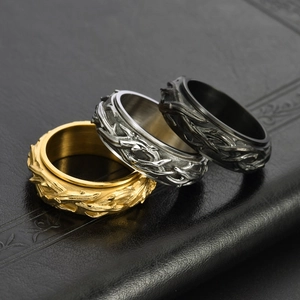Vintage thorn pattern stainless steel spinner rings in gold, silver, and black finishes