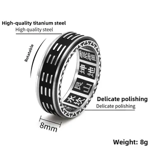 Macro shot of 8mm spinning ring showing Yin Yang Baqua symbols and engraved inner band