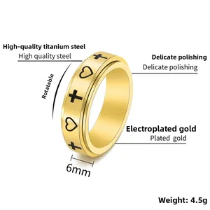 Detailed view of 6mm golden spinner ring featuring black heart and cross motifs