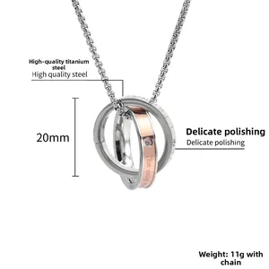 Detail view of interlocking double ring pendant with The Only Eternal engraving and zircon