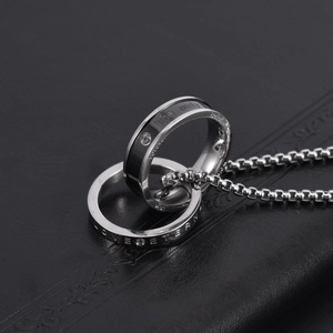 Titanium steel interlocking double ring necklace with LOVE ETERNAL engraving and crystal