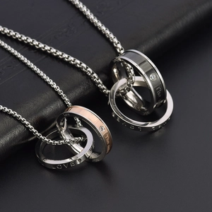 Polished titanium steel double interlocking rings necklace with LOVE engraving and crystal