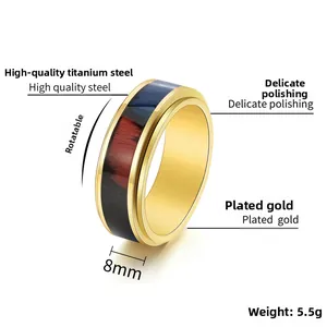 Macro detail of 8mm gold titanium spinner ring showing the wood grain rotating band