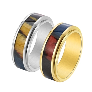 Rotating stainless steel rings with wood grain inlay in silver and gold finish
