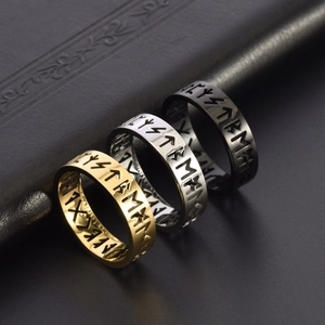 Set of three Viking rune rings in gold, silver, and black finishes on leather