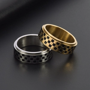 Men's rotating spinner rings with black and white checkerboard pattern in steel