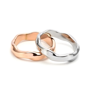 Minimalist Mobius stainless steel rings in polished gold and silver finishes