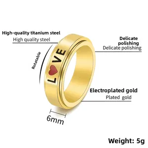 Detail showing 6mm gold stainless steel spinning ring with LOVE text and heart