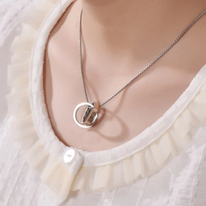 Titanium steel double ring necklace with LOVE engraving worn on neck model