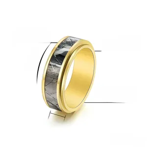 Detail of 8mm rotatable stainless steel ring with gold plating and camo inlay