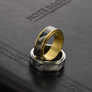 Pair of stainless steel spinning rings with camouflage inlay on black leather