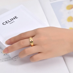 Golden stainless steel spinning ring with red heart and LOVE text on model's hand