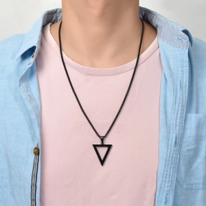 Minimalist black stainless steel triangle pendant necklace on a male model's chest