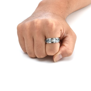 Detail of men's stainless steel rotating ring with camouflage inlay on hand