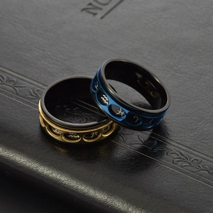 Rotating stainless steel zodiac spinner ring with hollow windows in blue and gold finish