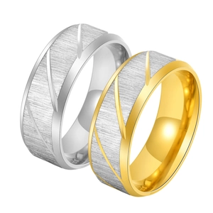 Detailed view of 8mm brushed stainless steel rings with geometric diagonal striped patterns
