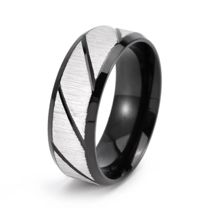 Macro view of 8mm black brushed ring featuring silver diagonal twill pattern texture