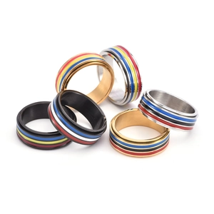 Polished stainless steel spinning rings with colorful rainbow stripes in gold, silver, black