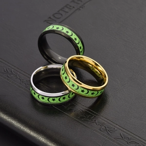 Luminous titanium steel rings with star and moon patterns in black, gold, and silver