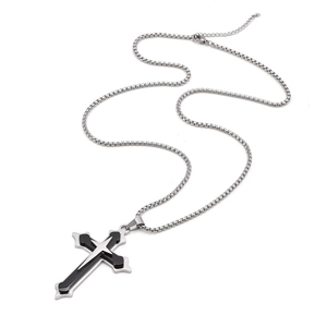 Detail of a three-layer stainless steel cross pendant with silver and black stacked design