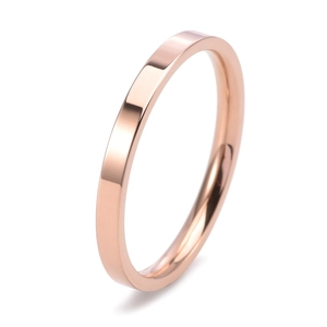 Macro detail of a polished rose gold 2mm slim minimalist titanium steel ring band