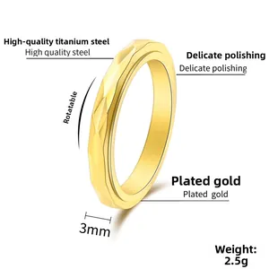 Close-up of 3mm gold spinner ring with diamond-cut geometric facets and 2.5g weight