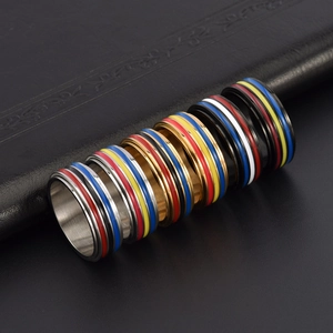 Macro detail of rainbow striped stainless steel rings on premium black leather