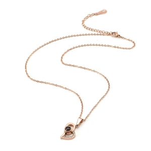 Rose gold heart projection necklace with zircon accents on a fine cross chain