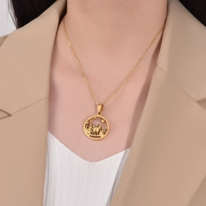 Golden stainless steel necklace featuring a hollow reindeer and forest silhouette pendant