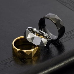 Faceted tungsten steel rings in gold, silver and black with polished geometric surfaces