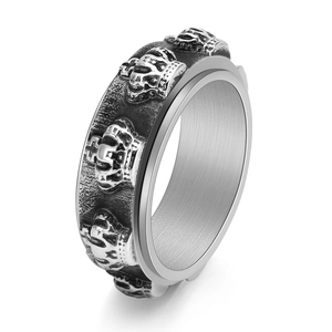 Vintage stainless steel spinning ring for men featuring detailed crown relief patterns