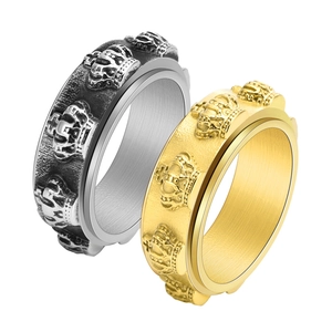 Detail of vintage crown embossed spinning rings in retro silver and gold finishes