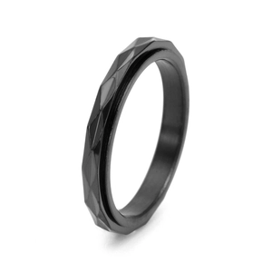 Detail of 3mm black rotatable spinner ring with geometric diamond-cut steel facets