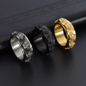 Macro shot of rotatable crown rings in silver, black and gold steel finishes