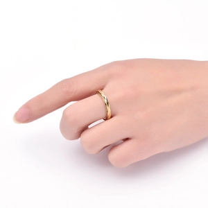 Detailed view of a 3mm golden stainless steel ring featuring geometric diamond facets