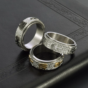 Three-piece set of Egyptian Ankh and Eye of Horus spinner rings in vintage stainless steel