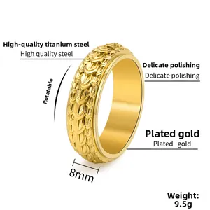 Macro view of 8mm gold rotatable titanium steel ring with dragon scale texture