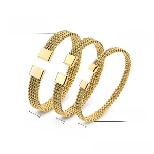 Detailed view of three gold braided steel cuff bracelets in 6mm, 8mm, and 10mm widths