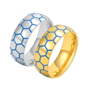 Detailed view of silver and gold stainless steel rings with blue hexagonal honeycomb patterns