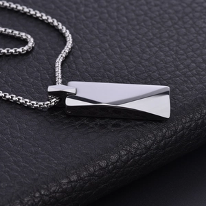 Sleek tungsten steel rectangular geometric pendant with box chain on leather background