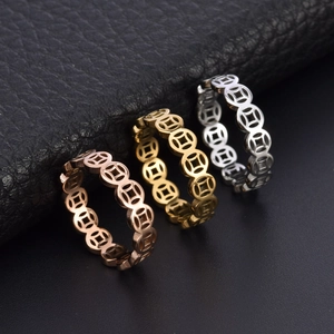 Three-color titanium steel rings with hollowed ancient coin motifs in gold and rose gold finishes