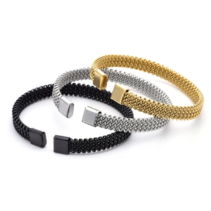 Detail view of woven stainless steel bracelets in gold, silver, and black finish