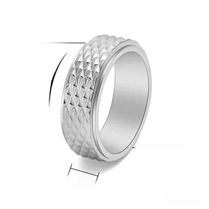 Detail showing 8mm rotatable titanium steel men's ring with diamond faceted texture