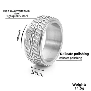 Detail of 10mm wide rotatable titanium steel spinner ring with tire tread pattern