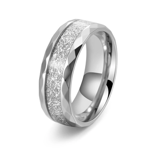 Titanium steel ring with faceted edges and frosted meteorite texture on white background